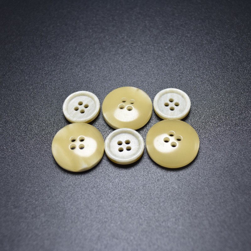 Flat thick rim four holes two-side with white & yellow button urea button for coat