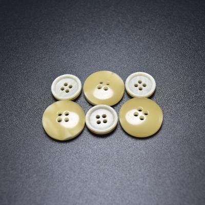 Flat thick rim four holes two-side with white & yellow button urea button for coat